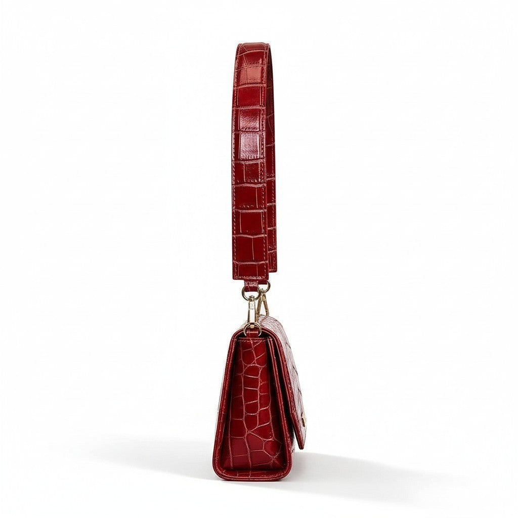 Borsa Amatì Lady rossa in vera pelle stampa coccodrillo con tracolla e dettagli metallici dorati vista laterale