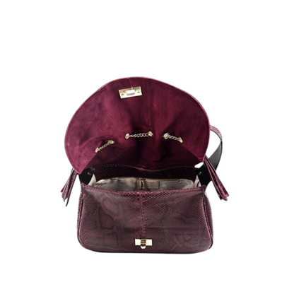 Borsa Amatì Onice in vero pitone bordeaux con interno spazioso, chiusura dorata e nappe decorative